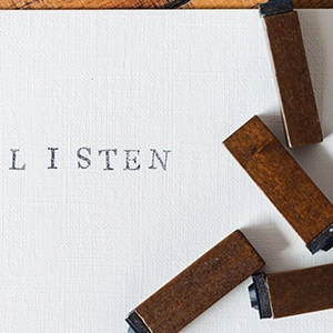 Listen spelled out in type