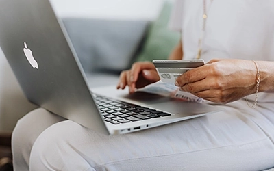 Women using a credit card to purchase online